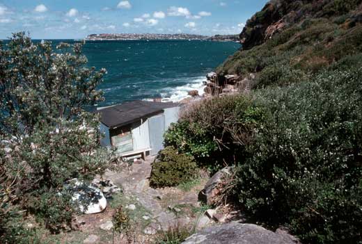 The view south over Sydney Harbour shows the Men's Hut, built in the late 1920s, in the foregraound.