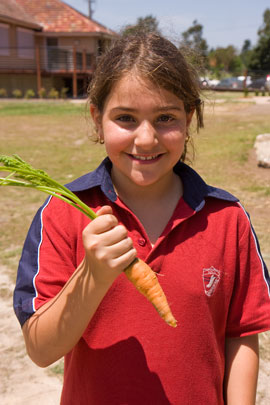 CPCG_opening_Louiza Louiza, with her first harvest. Louiza is a younger member of Carr Park Community Garden.