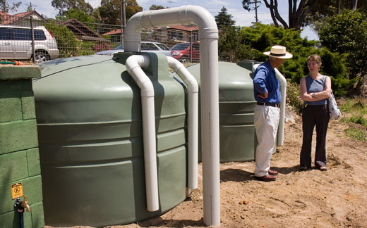 CPCG_opening_tanks The community garden's tanks store rainwater harvested from the roof of the strawbale classroom. The tanks are gravity filled and the water irrigates the garden.