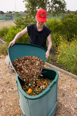 rc-garden5 Fiona adds dried leaves to the training garden compost bin to amend a slightly acidic compost.