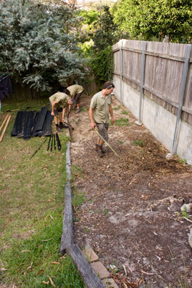 Garden-construction-221209_12 DAY ONE, morning; The work starts by stockpiling the materials for the garden and marking the location for the raised garden beds. Steve Batley, the landscape architect who set up Sydney Organic Gardens (www.sydneyorganicgardens.com.au) and a past permaculture design student of ours, is seen with the measuring tape.