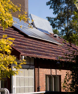 Barrett-House_rooftop-arrays-280510 Solar electric and solar space hating arrays on the roof of Barrett house.