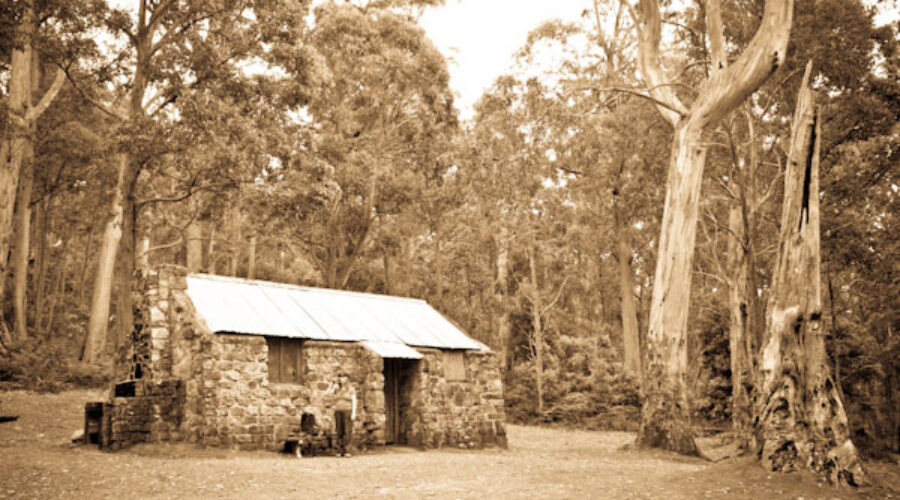 Three huts on a trail