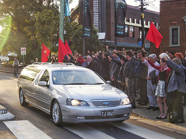 Friends, family, colleagues line the footpath to say their final farewell to a man the memory of whom will stay with them.